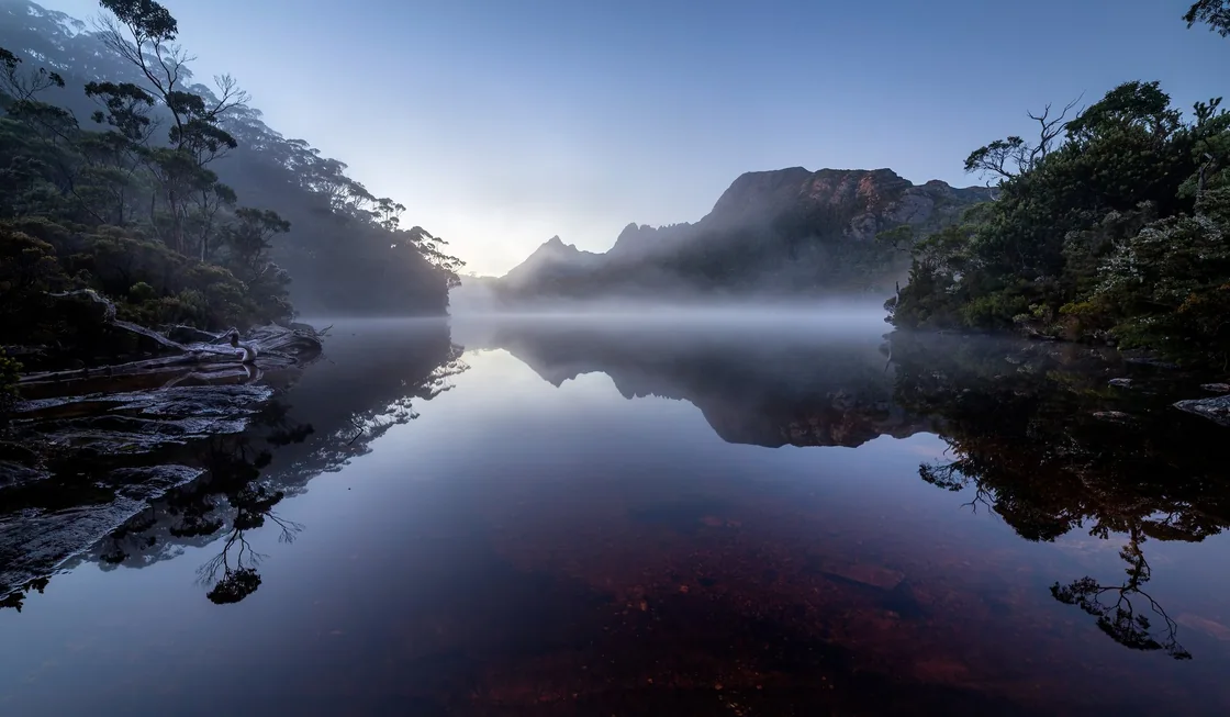 Still water and mist around Lake Lilla at dawn